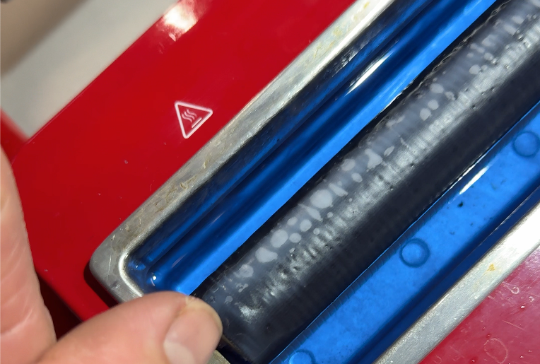 Image of a wax roller at various temperatures that are not hot enough yet to use it on skis.