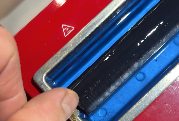 Image of a wax roller at various temperatures that are not hot enough yet to use it on skis.