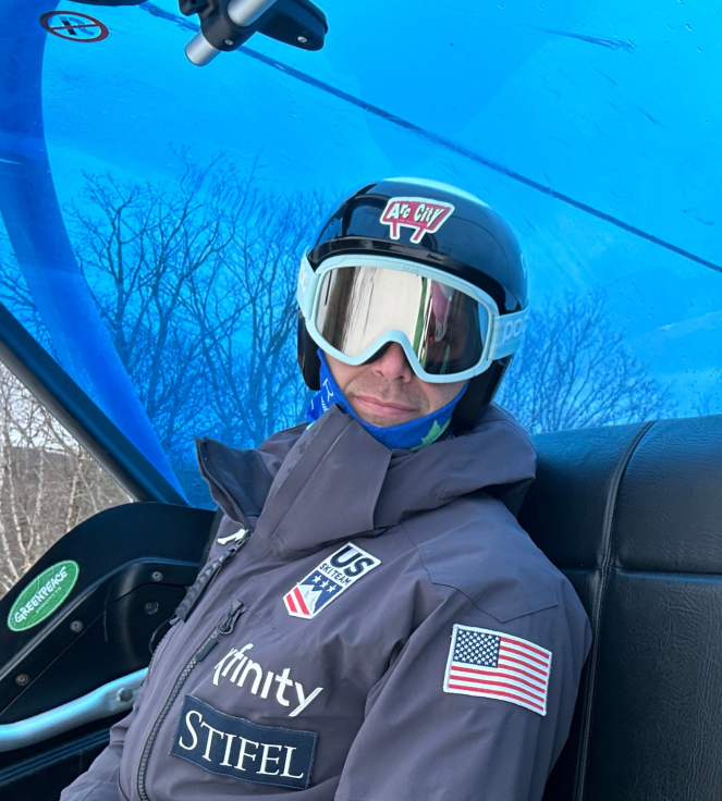 Mike Beers of Race tech Ski Service riding the lift while working with the U.S. Ski Team at Copper Mountain